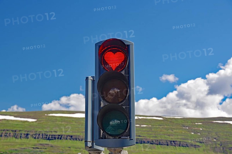 Traffic lights with red heart