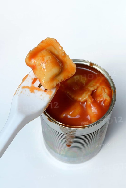 Ravioli in tin and plastic fork