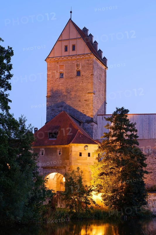 Illuminated Rothenburg Gate at dusk