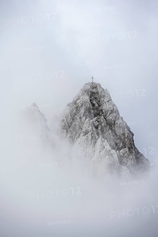 Summit in clouds and fog