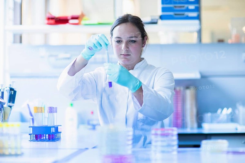Lab technician pipetting a sample in the lab