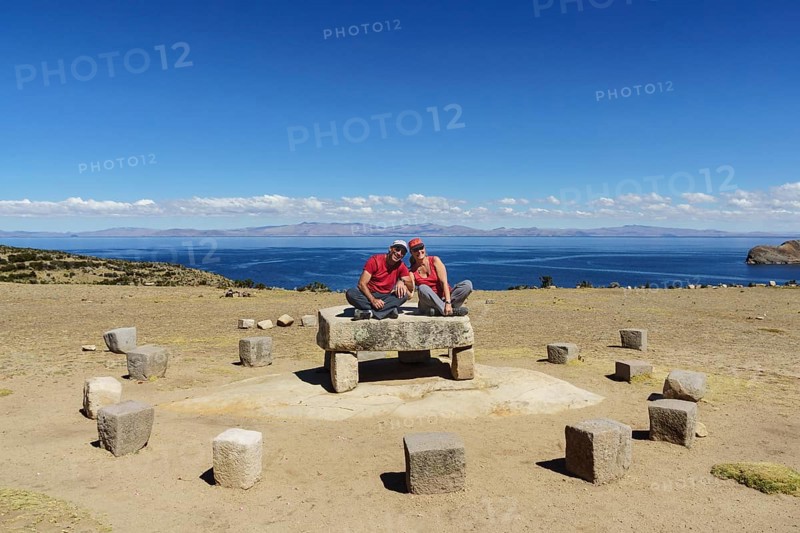 Older couple sitting on the Roca Sagrada