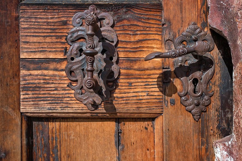 Old iron roof beacons at the gate of the chapel in the courtyard of Blutenburg Palace