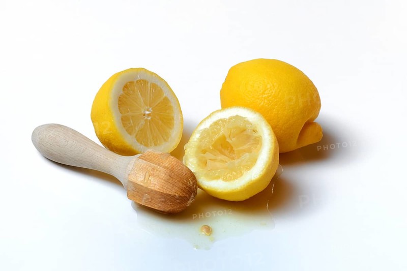 Lemons and lemon squeezer