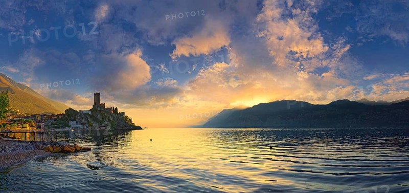 Historic coastal town of Malcesine with the Castello Scaligero castle at sunset