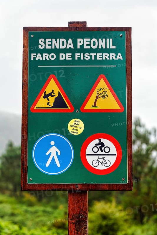 Wooden sign pedestrian way with traffic signs and warnings