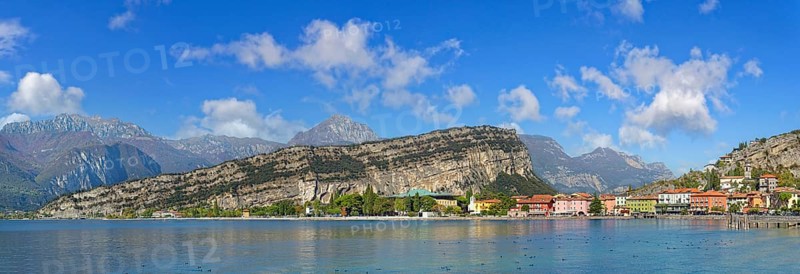 Coastal town panorama with colourful houses and the rocky mountain Monte Brione