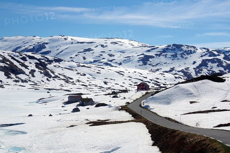 Road winds through wintry landscape in the Fjell