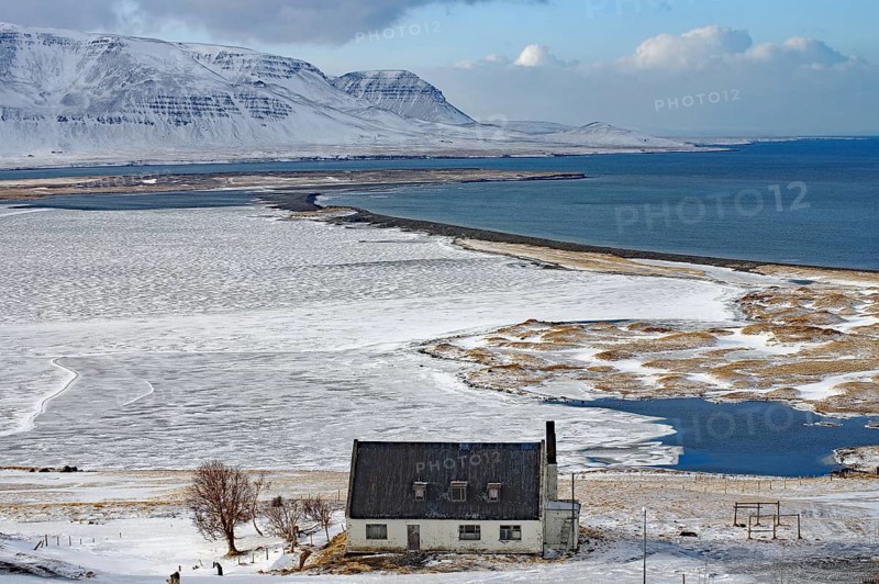 Abandoned house in front of wide bay