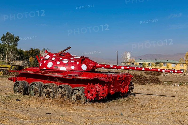 Old soviet tank coloured in funky colours