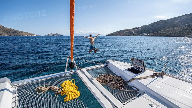 Young man jumps into the water