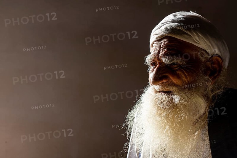Sufi priest studying