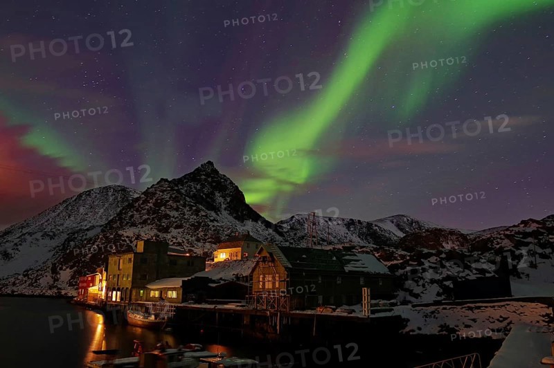 Small harbour with illuminated houses