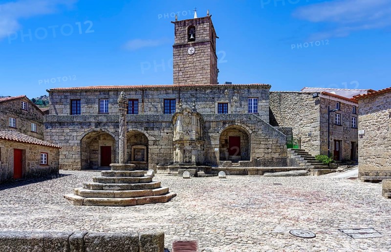 Main square with former city hall and bell tower