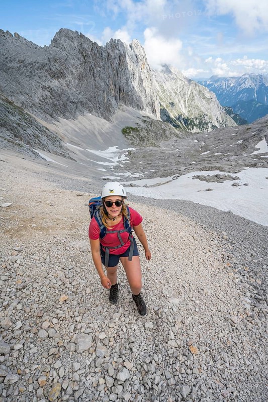 Hiker crossing a scree field