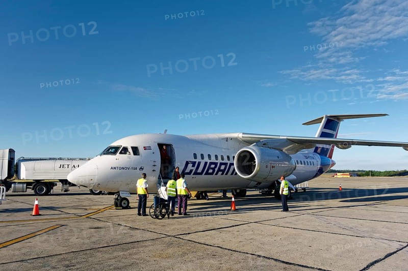 Passengers disembark Antonov An-158 regional jet