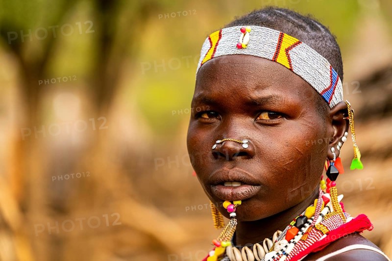 Traditional dressed young girl from the Laarim tribe