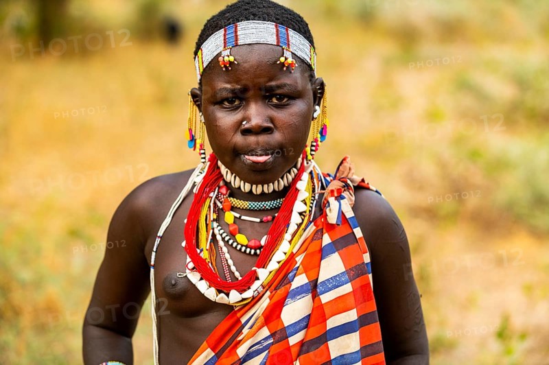 Traditional dressed young girl from the Laarim tribe