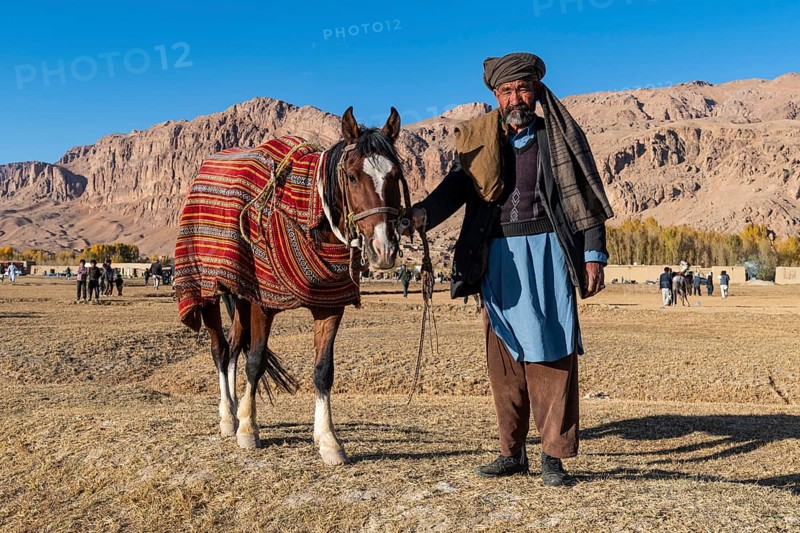 Old man with his horse at a Buzkashi game