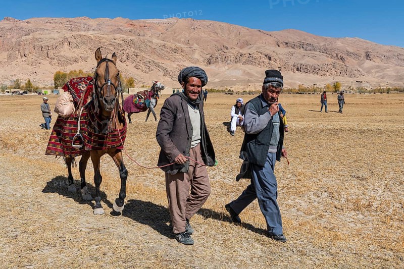Old men with their horses at a Buzkashi game