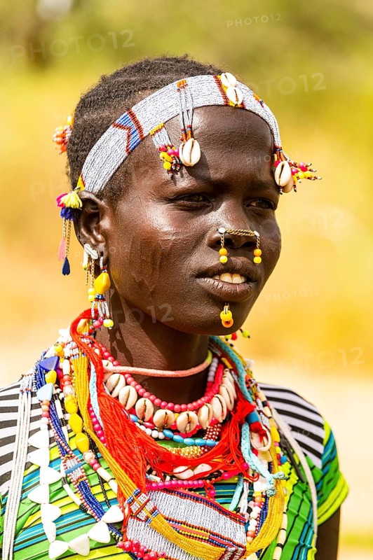 Traditional dressed young girl from the Laarim tribe