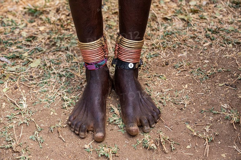 Close up from foot rings on the legs from a girl of the Laarim tribe