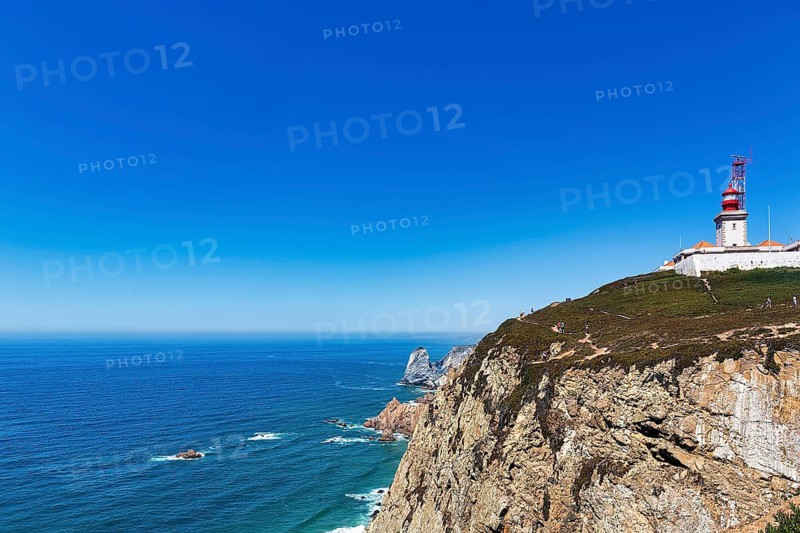 Lighthouse on rocky coast on the Atlantic Ocean