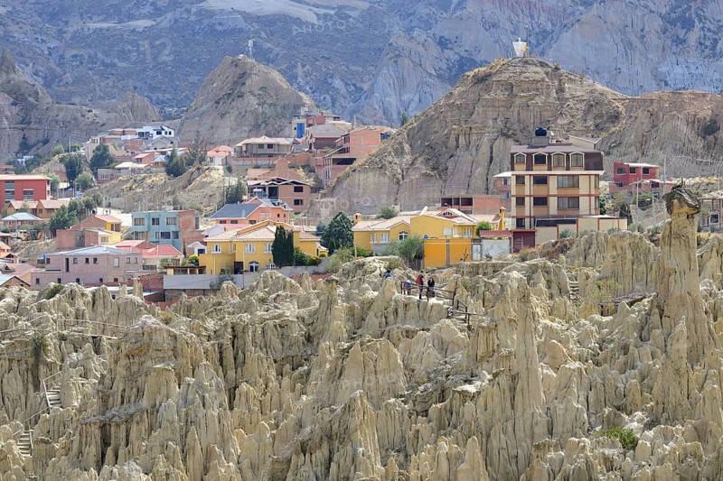 Residential houses behind the bizarre rock formations in Valle de la Luna
