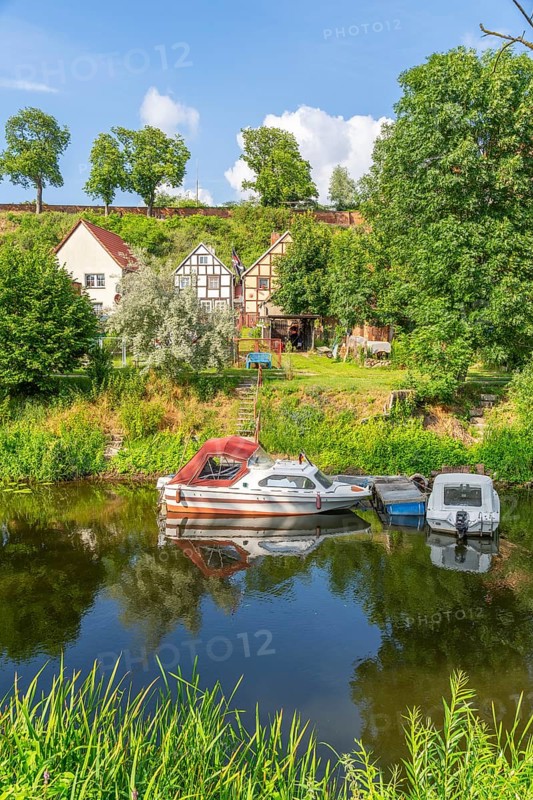 View across the moat to half-timbered houses