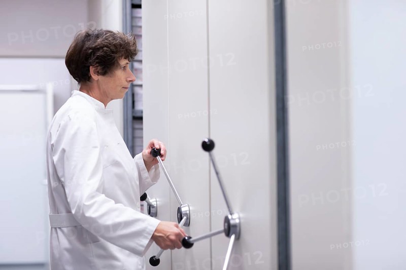 Technician working in a laboratory archive