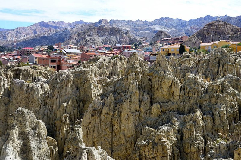 Homes behind the bizarre rock formations in the Valle de la Luna