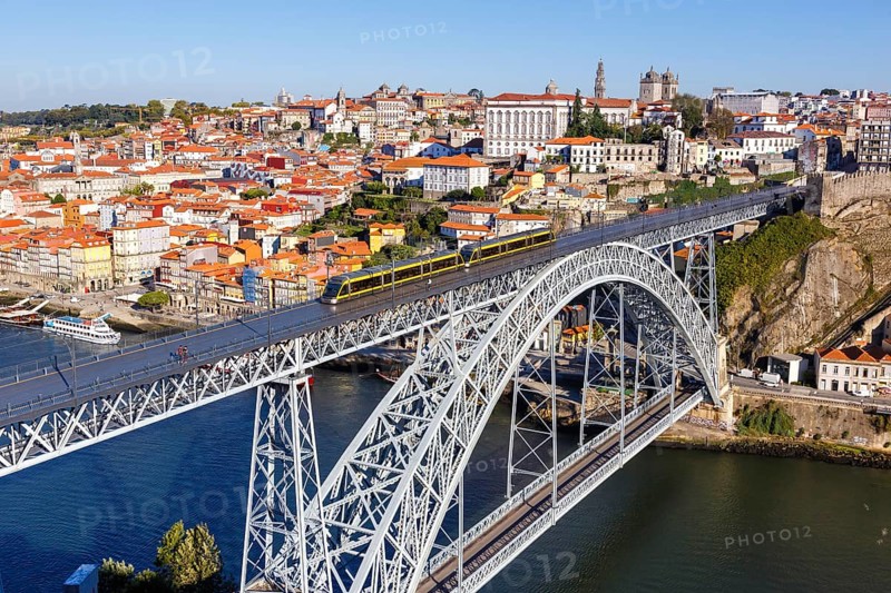 Porto with bridge Ponte Dom Luis I over river Douro and tramway travel city in Porto