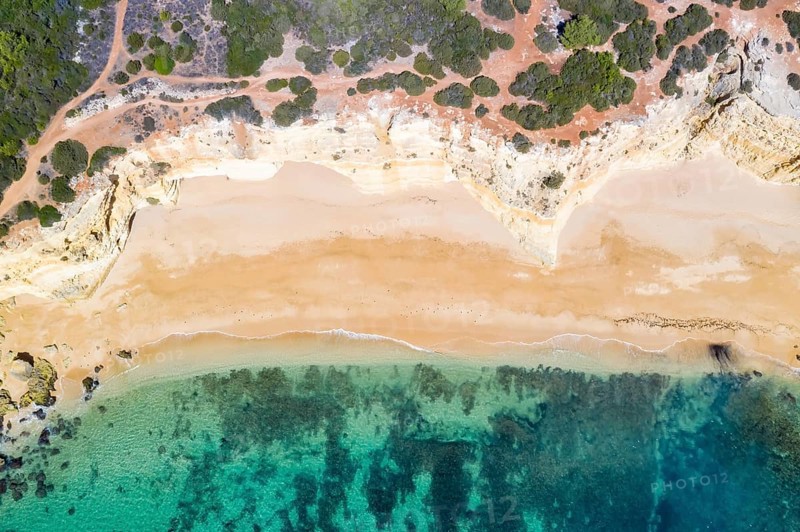 Portugal Algarve beach Praia da Marinha sea ocean drone shot from above in Praia da Marinha