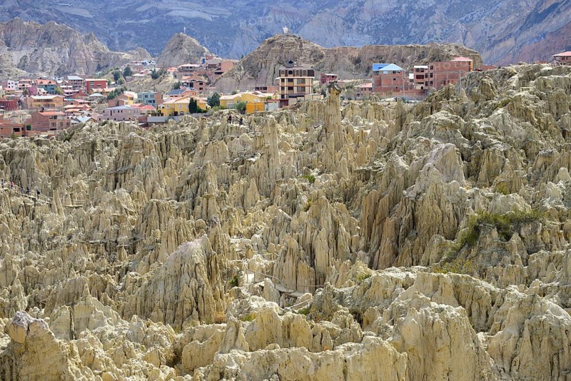 Residential houses behind the bizarre rock formations in Valle de la Luna