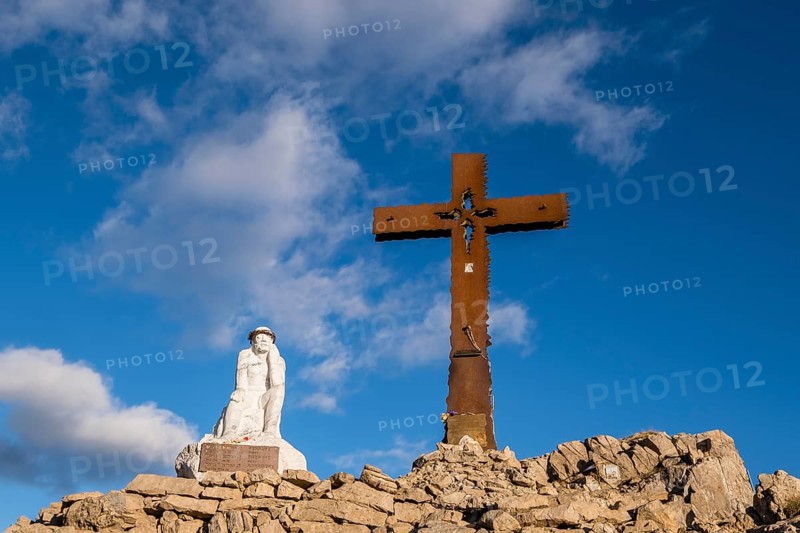 Summit cross and Jesus figure on Monte Castellaz
