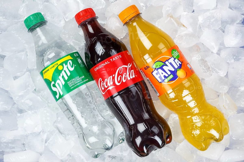 Coca Cola Coca-Cola Fanta Sprite lemonade drinks in plastic bottles on ice cube ice cubes
