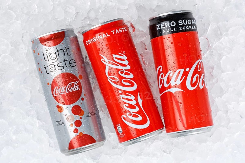 Coca Cola Coca-Cola Products Lemonade Soft Drink Beverages in Cans on Ice Ice Cube