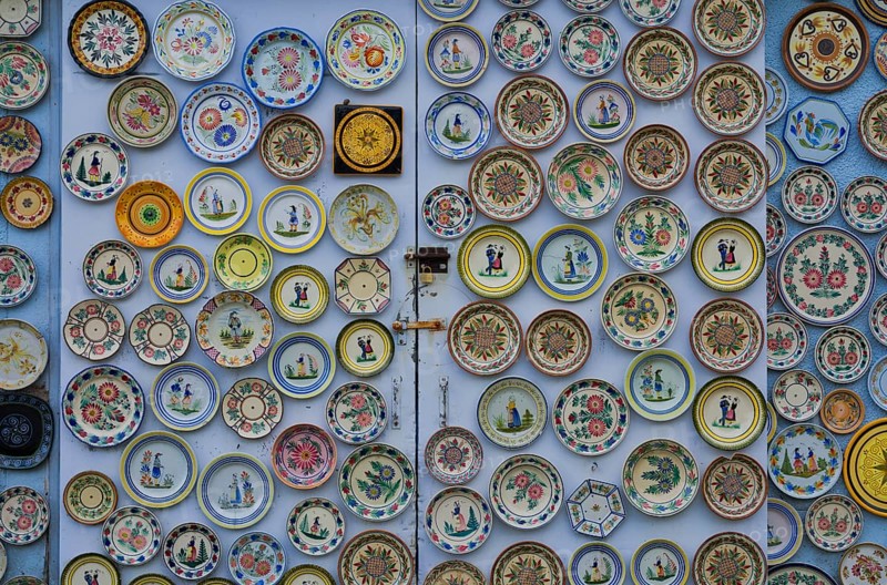 Hand-painted collection plates decorate house wall