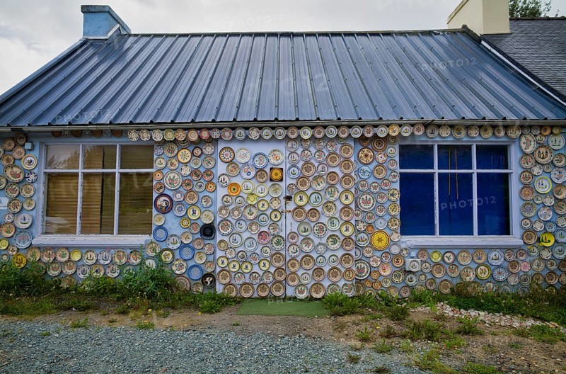 Hand-painted collection plates decorate house wall