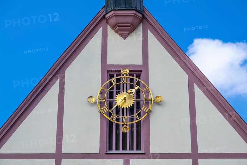 Clock on the gable of the town hall in Gemuenden am Main
