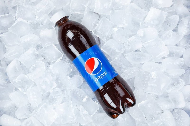 Pepsi Cola in plastic bottle lemonade soft drink drink on ice cube ice cubes