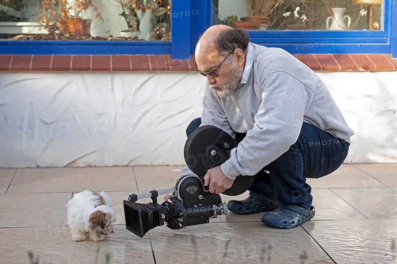 Animal photographer films Bolonka Zwetna puppy with 16mm camera