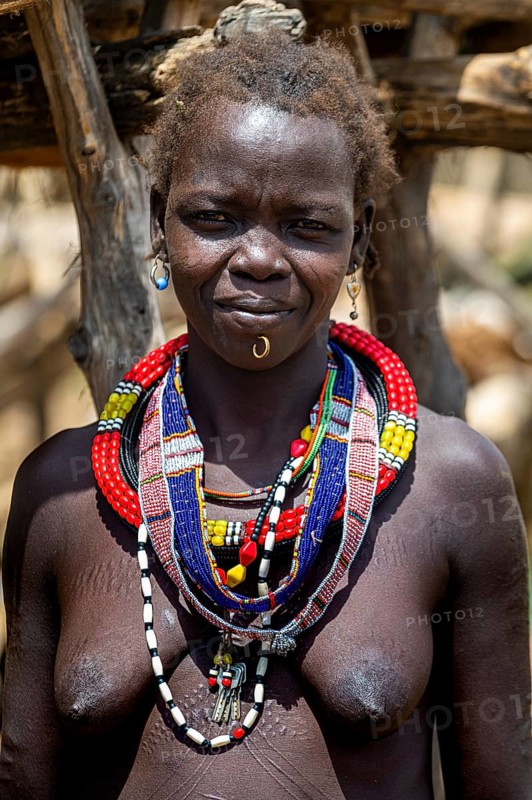 Friendly traditional dressed girl from the Toposa tribe