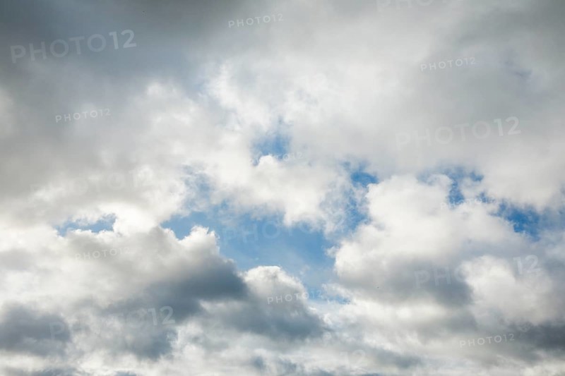 Stratocumulus clouds and blue sky windows form spectacular cloud formation in the sky during Foehn storm