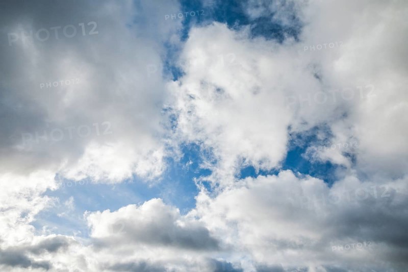 Stratocumulus clouds and blue sky windows form spectacular cloud formation in the sky during Foehn storm