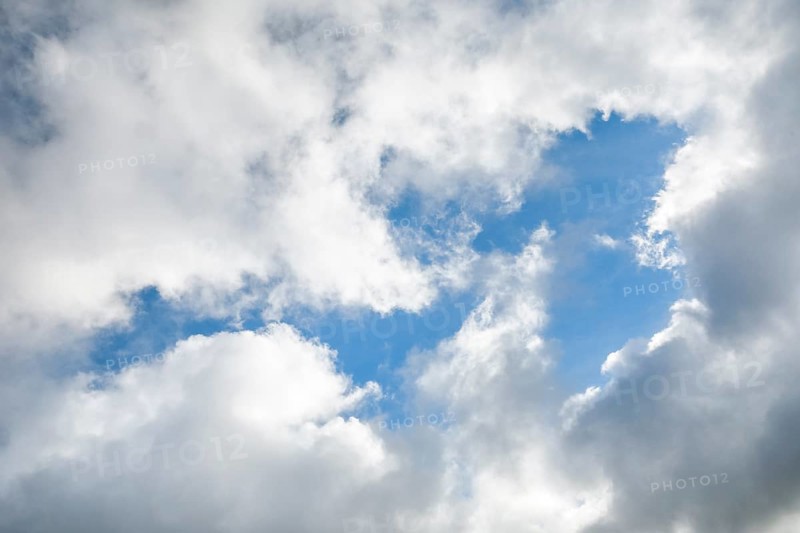 Stratocumulus clouds and blue sky windows form spectacular cloud formation in the sky during Foehn storm