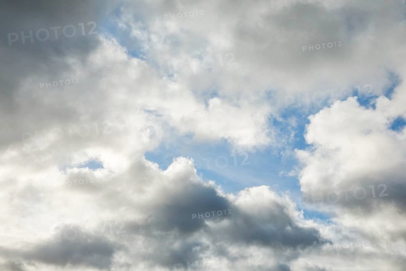 Stratocumulus clouds and blue sky windows form spectacular cloud formation in the sky during Foehn storm