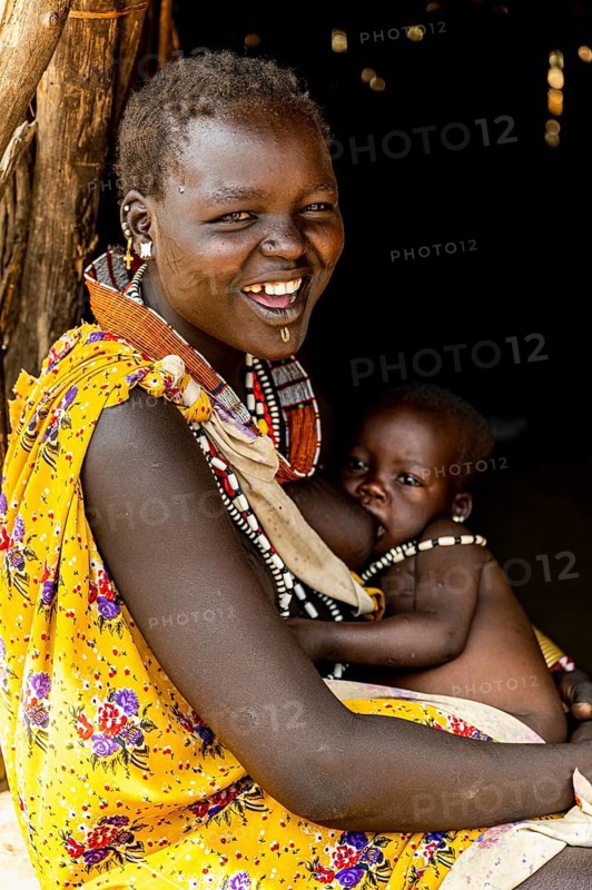 Woman from the Toposa tribe breastfeeding her baby
