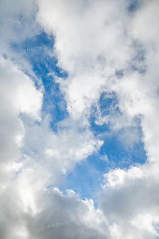 Stratocumulus clouds and blue sky windows form spectacular cloud formation in the sky during Foehn storm