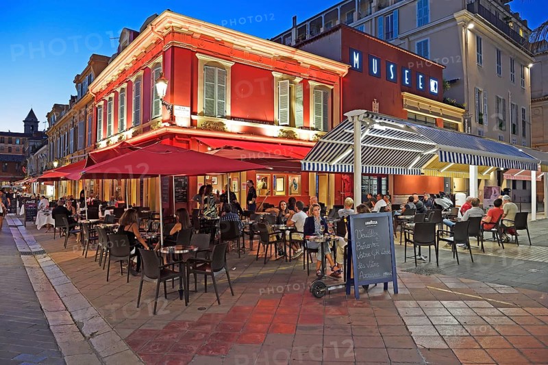 Evening hustle and bustle with restaurants and market stalls on the Cours Saleya